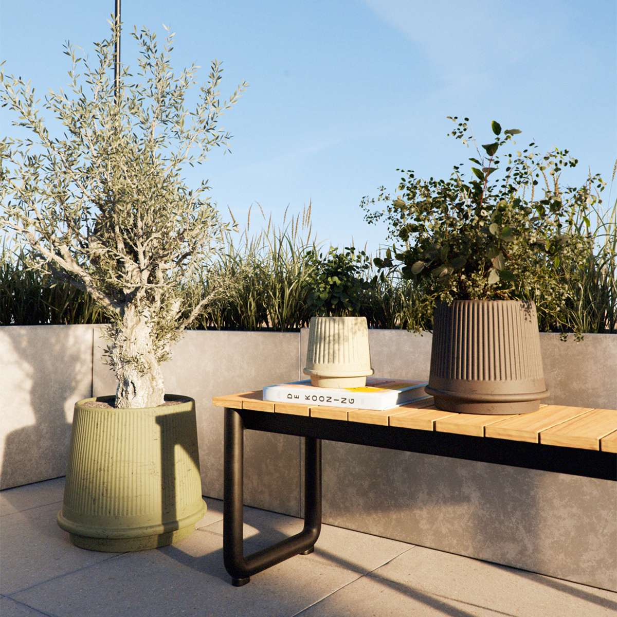 Matte fluted ceramic outdoor planter with drainage hole in natural color on a light surface