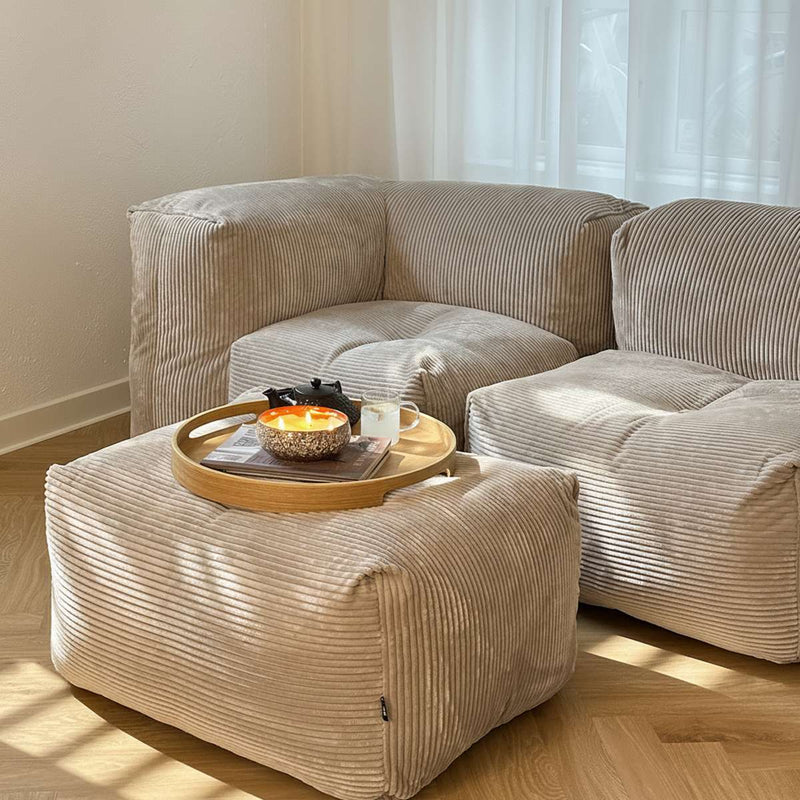 Soft Sofa Indoor pouf in olive corduroy fabric with a soft, rounded shape and low height.