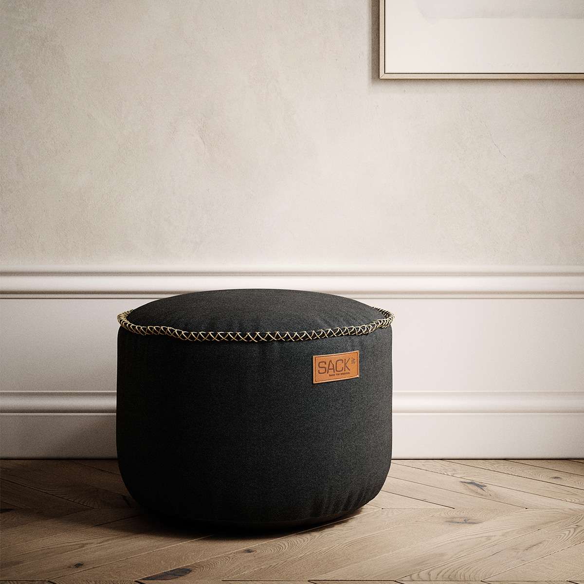 Two Canvas Pouf 2 Pack in black and sand colors with hand-sewn linen stitches on a white background.