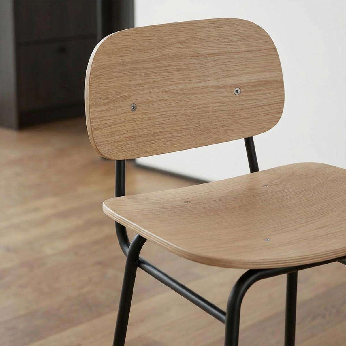 Frame Bar Stool with backrest featuring oak veneer seat and black powder-coated steel frame in industrial style