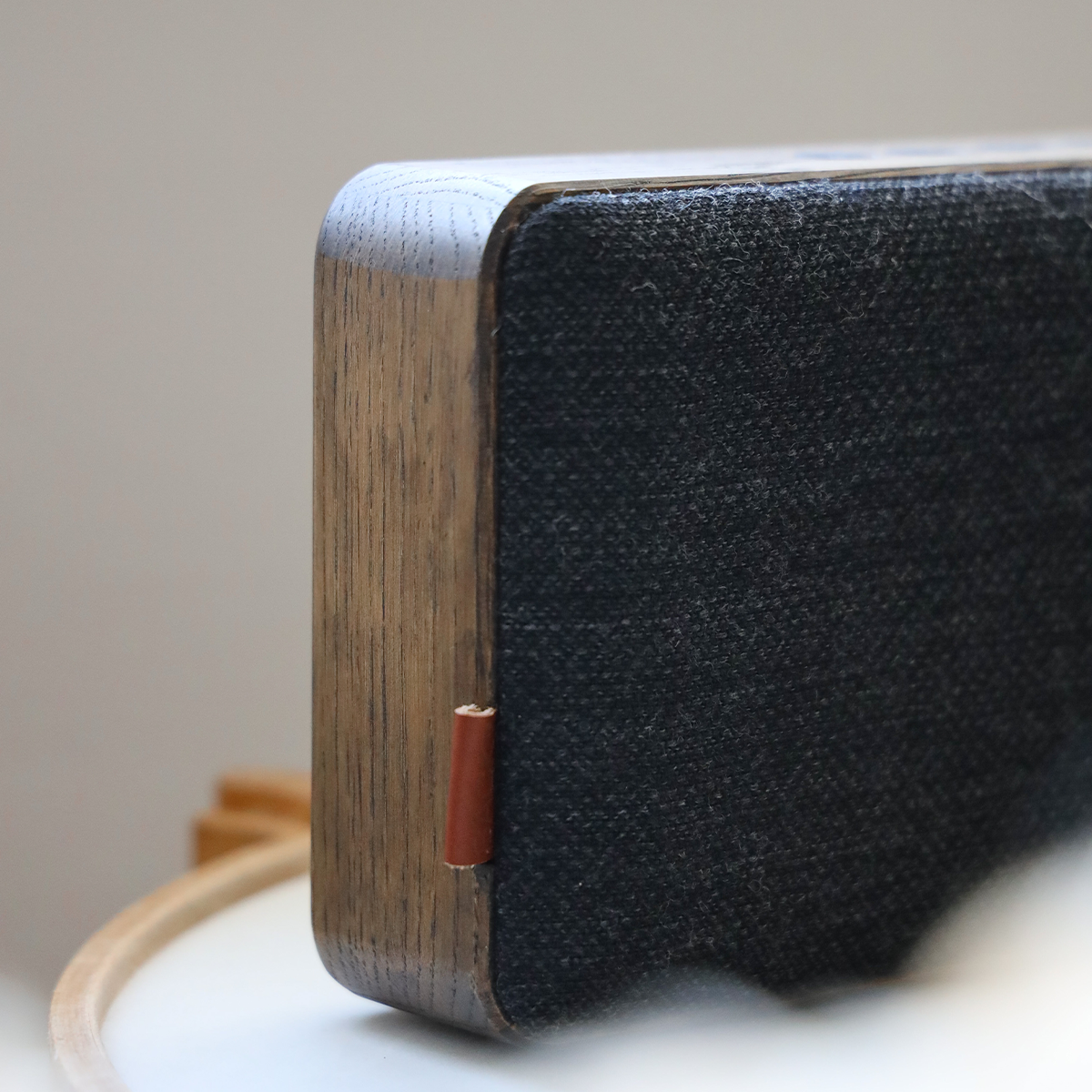 Natural oak Move Wood Bluetooth speaker with solid wood and Fiord textile design on a white background