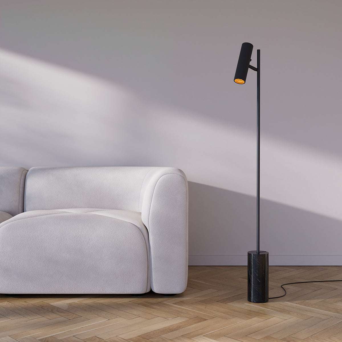 Black Expo Floor lamp with matte aluminum body and polished marble base in a living room setting