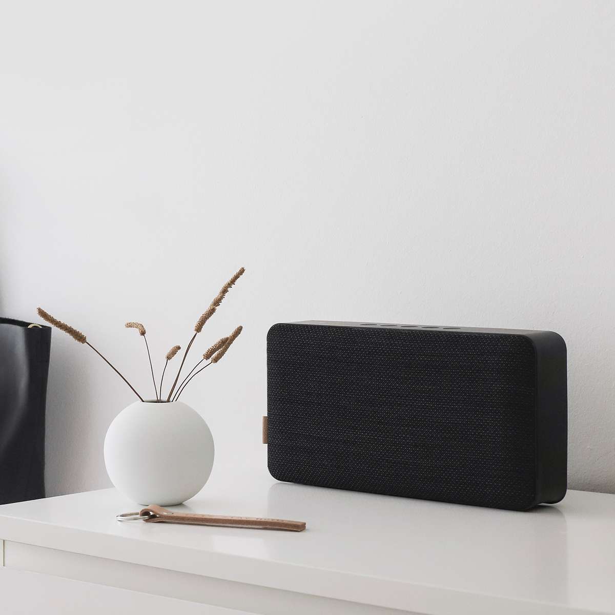 Black Move 150 Bluetooth speaker with Fiord fabric front panel and leather details on a white background