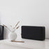 Black Move 150 Bluetooth speaker with Fiord fabric front panel and leather details on a white background