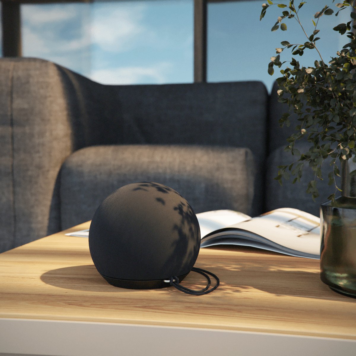 Compact black Play Mini Bluetooth speaker with silicone buttons and durable textile cover.