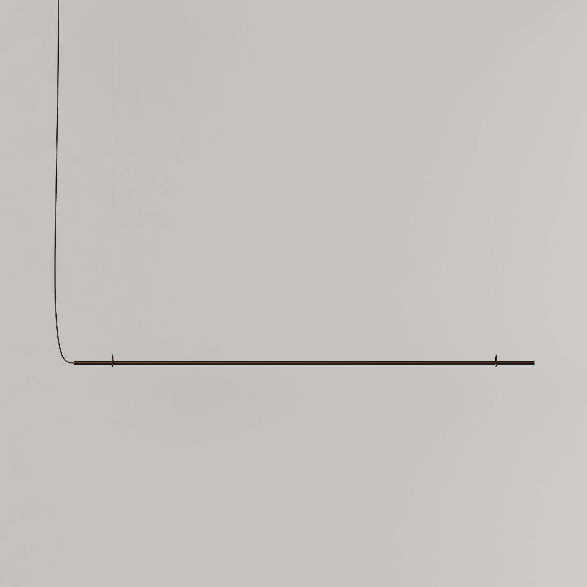 Ease 180 pendant lamp for the dining table in Bronze by sackit switched on, casting warm light