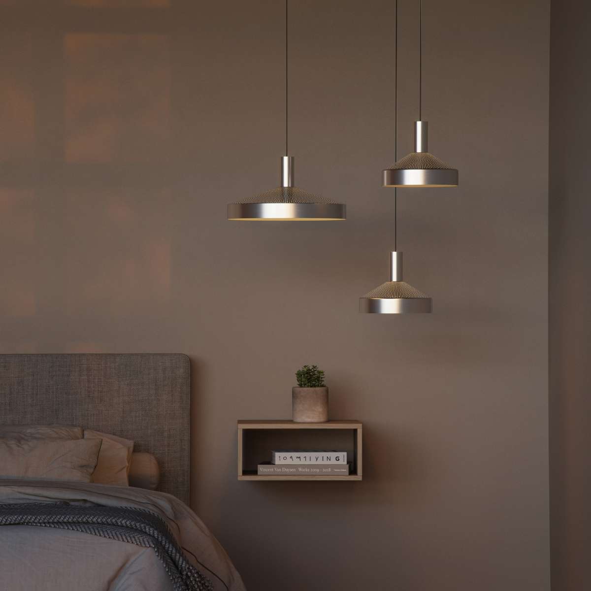 Polished aluminum Dawn Pendant Ø25 with perforated top and white inner shade hanging indoors