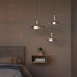 Polished aluminum Dawn Pendant Ø40 with perforated top and white inner shade hanging indoors