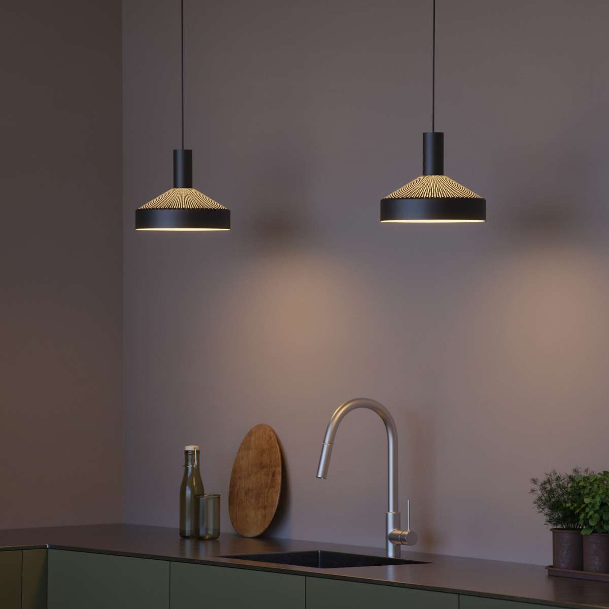 Black Dawn Pendant Ø25 with perforated top and kinked edge, hanging indoors with 3-meter wire.