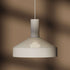White Dawn Pendant Ø25 with perforated top and kinked edge, hanging indoors with aluminum finish