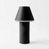 Black Cone cordless table lamp by sackit Europe with a cylindrical base and broad tapered shade for indoor and outdoor lighting