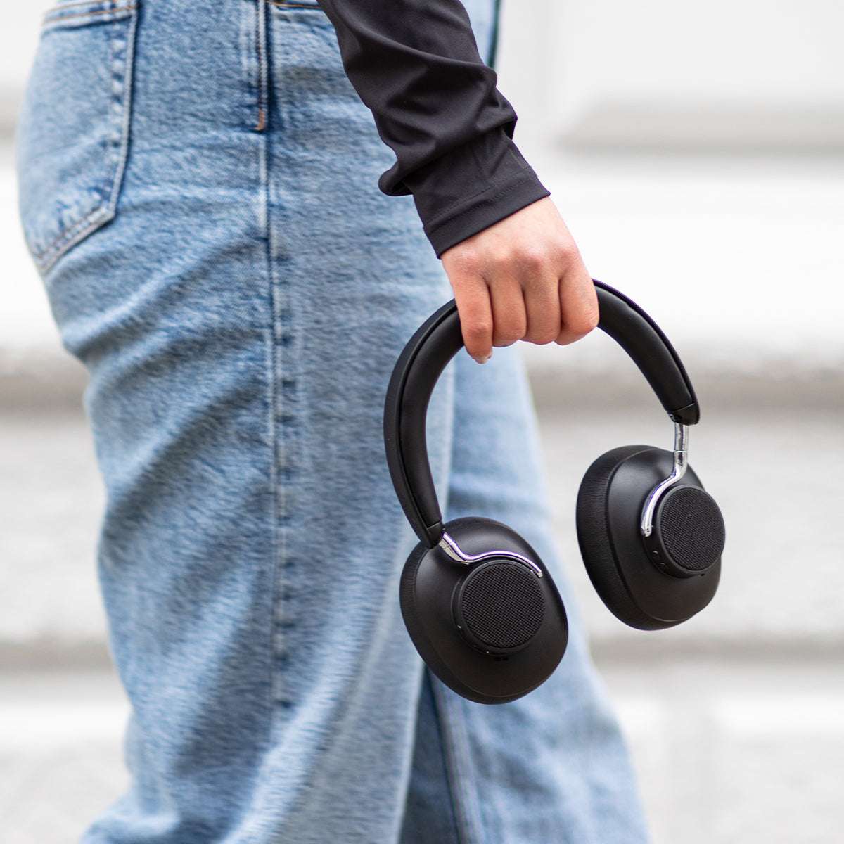 Black Touch 310 over-ear headphones with padded ear cups and adjustable headband on a white background.