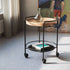 Serving table with black powder-coated steel frame and natural oak round serving tray on top