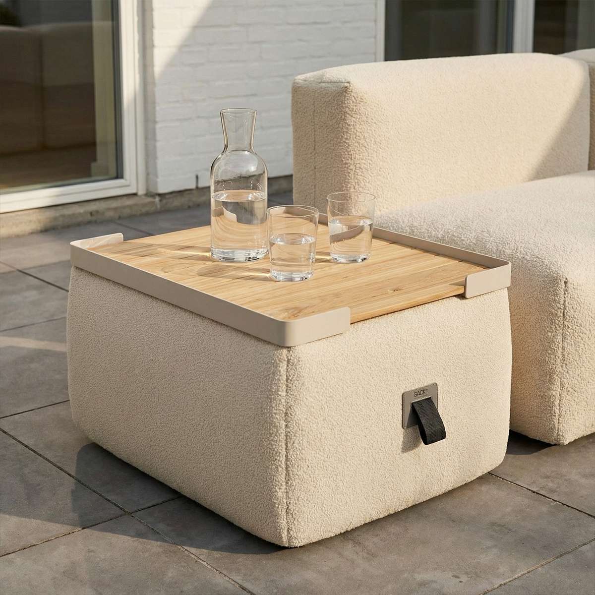 Square taupe teak and aluminum outdoor tray designed for Soft Sofa Outdoor Pouf on a patio setting