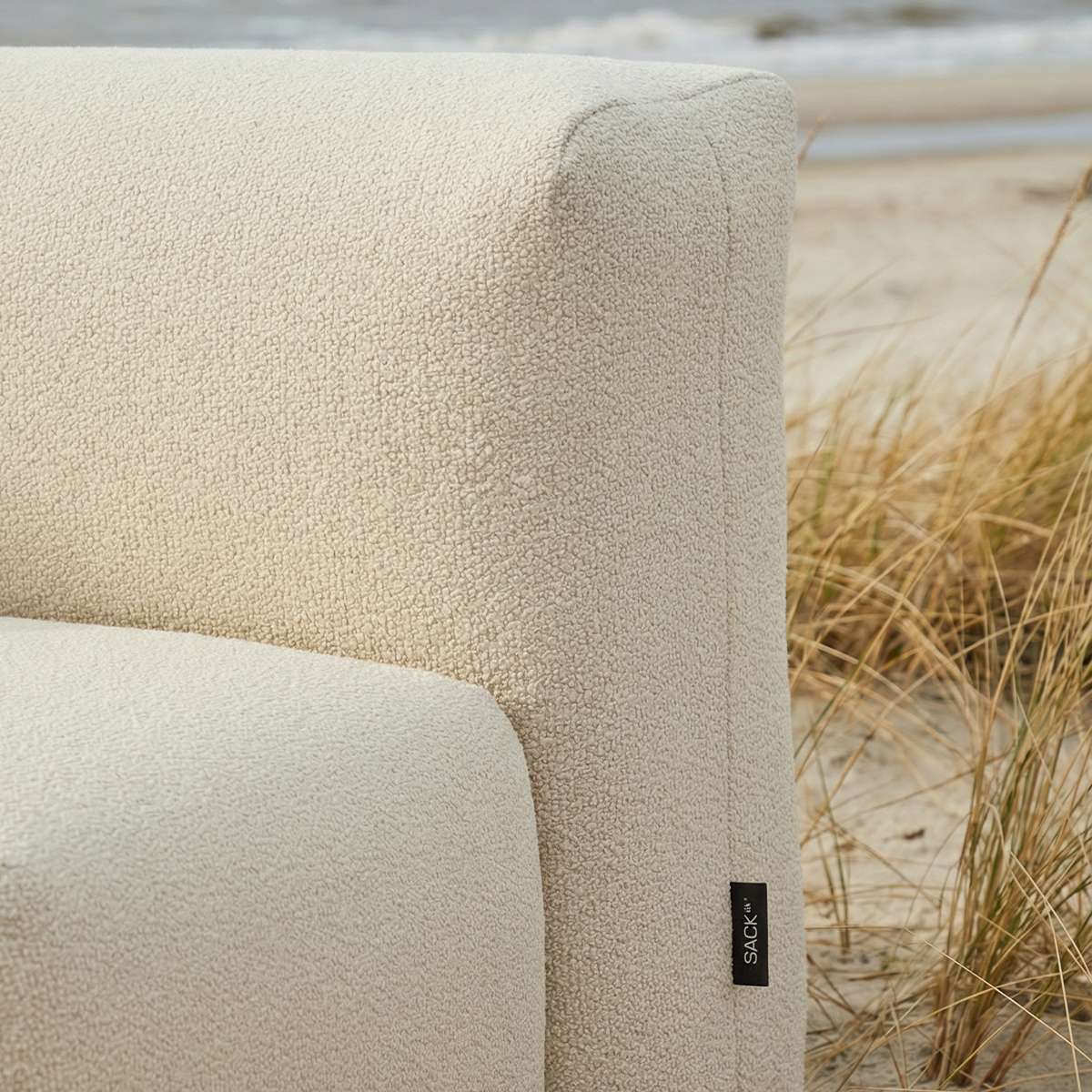Soft Sofa Outdoor corner sofa in beige boucle fabric, designed for comfortable outdoor living.