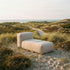 Outdoor lounger from Soft Sofa with light beige boucle fabric and soft cushions.