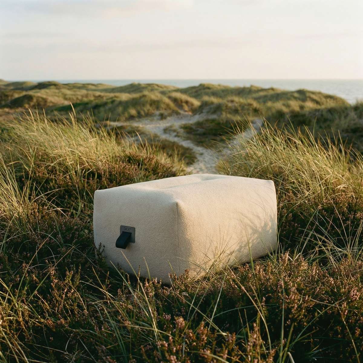 Bouclé beige Soft Sofa Outdoor pouf with soft, rounded shape for outdoor seating or lounging