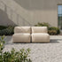 Soft Sofa Outdoor seat in boucle beige fabric placed in a bright outdoor setting