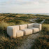 Boucle Beige Soft Sofa Outdoor 3-seater with soft cushions and low backrest placed outside on a patio