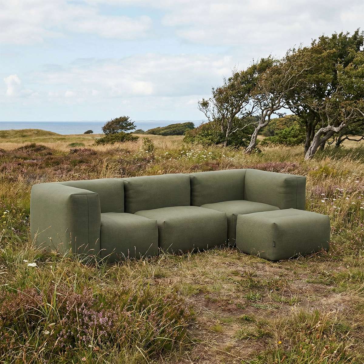 Kirra Olive Soft Sofa Outdoor 3-seater with pouf in a relaxed outdoor setting