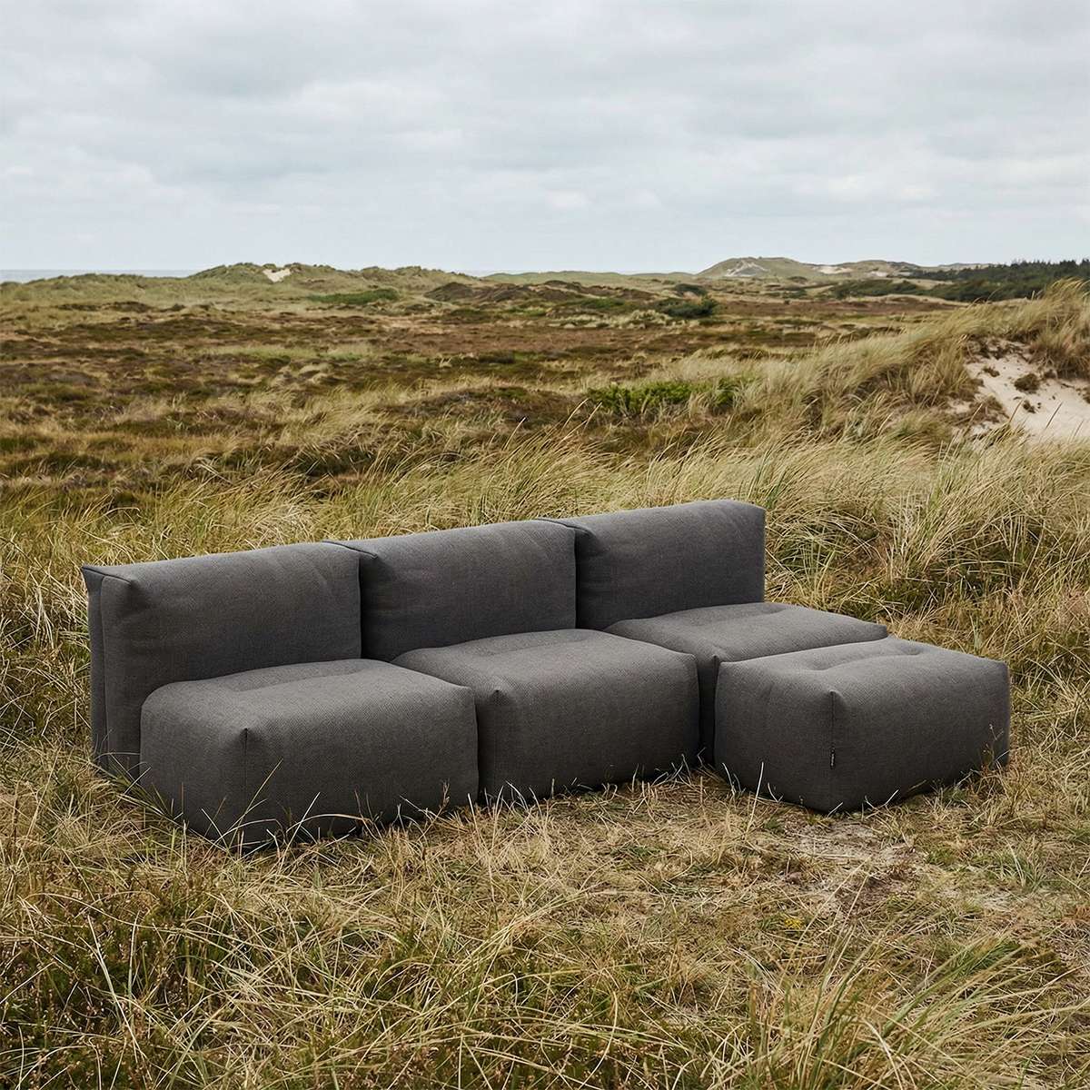 Soft Sofa Outdoor 3-seater with pouf in Kirra Olive color, soft fabric, modern outdoor setting.