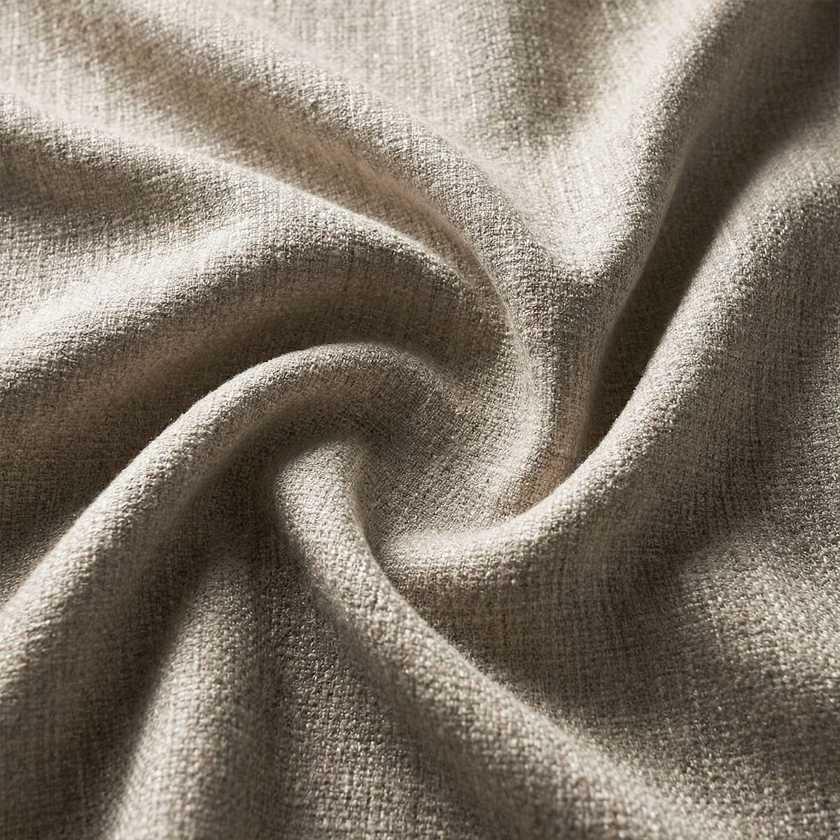 Close up of soft taupe textured outdoor upholstery fabric for a sackit sofa designed for comfortable weather resistant Nordic living