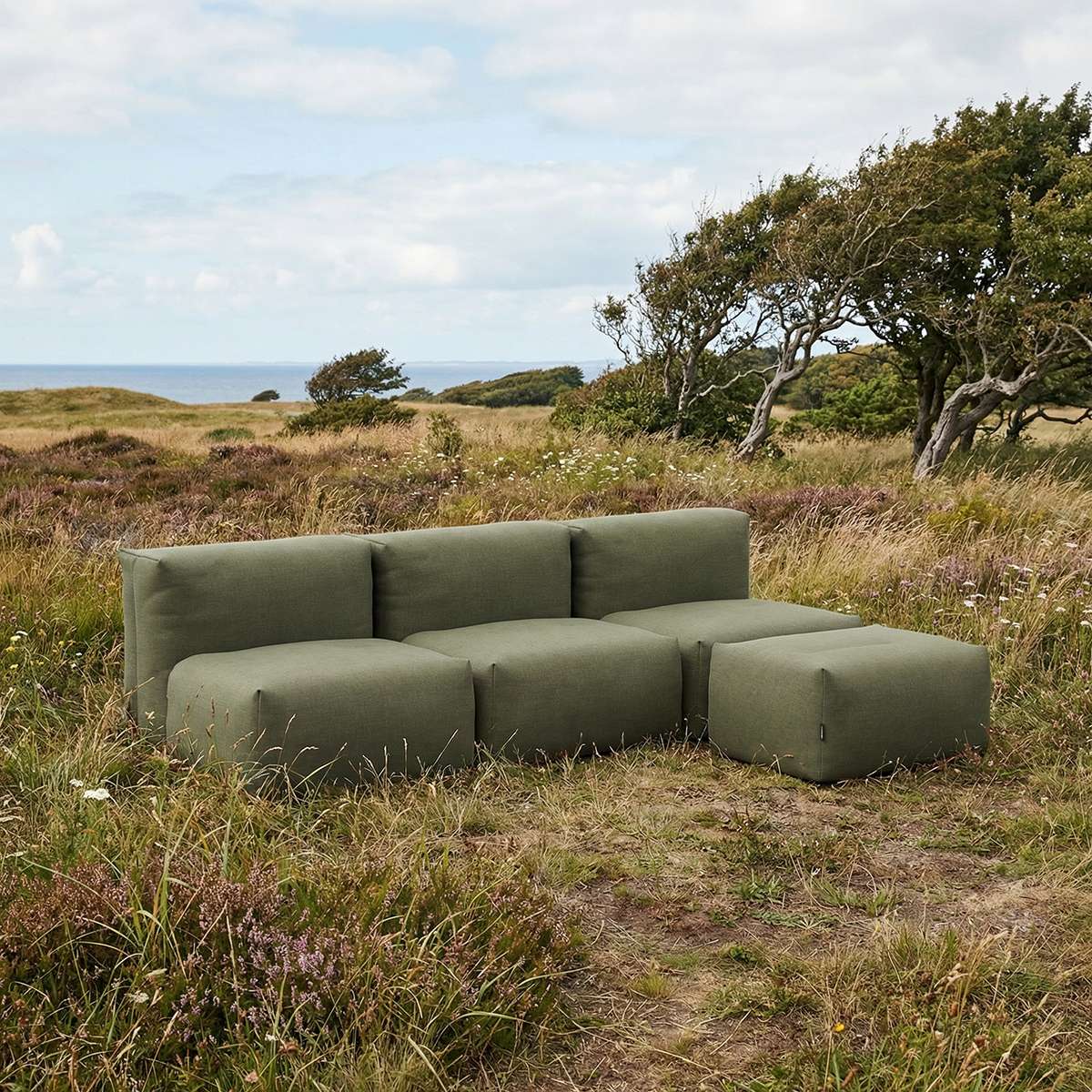 Kirra Olive Soft Sofa Outdoor 3-seater open with pouf in an outdoor setting