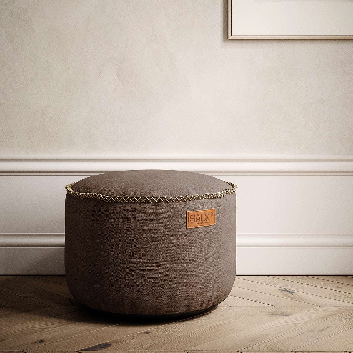 Canvas Pouf in canvas petrol color with hand-sewn linen stitches, round shape, and soft fabric texture.