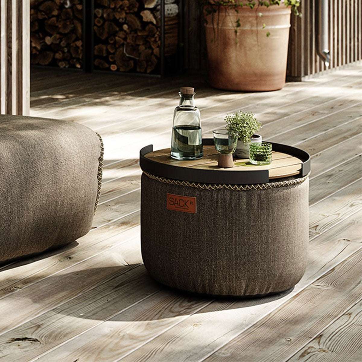 Round Cobana Grey pouf with durable fabric and hand-sewn stitches for indoor and outdoor use