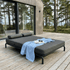 Kirra Double Sunbed in Kirra Sand with powder-coated aluminum frame and olefin textile outdoors on a terrace