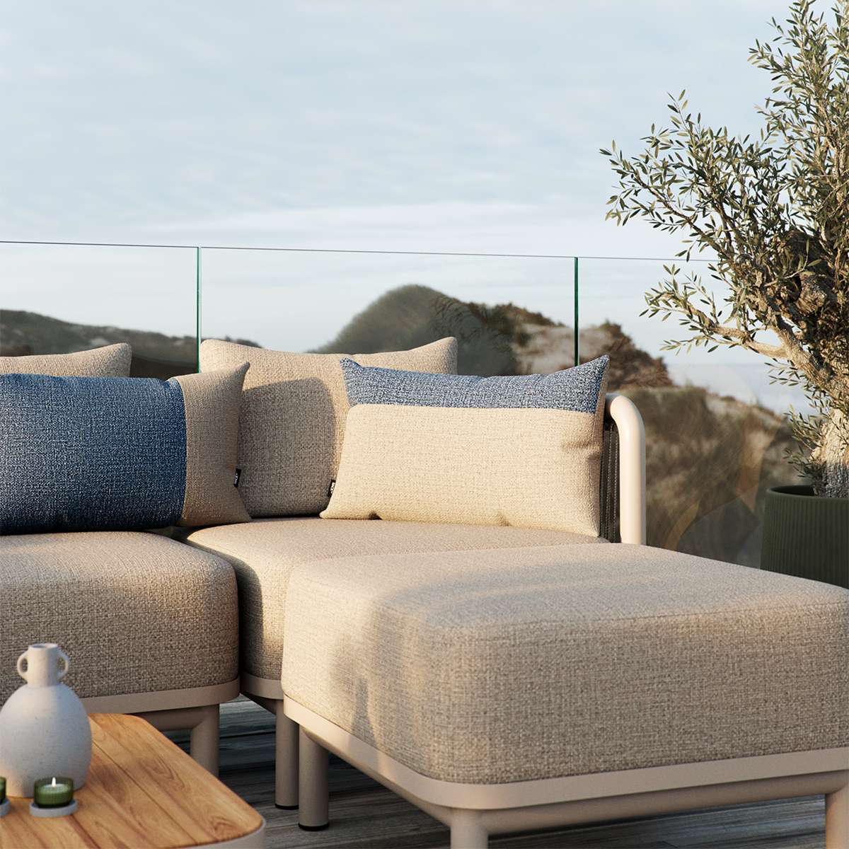 Sand and indigo color block Tide Cushion made of durable outdoor fabric on a wooden bench.