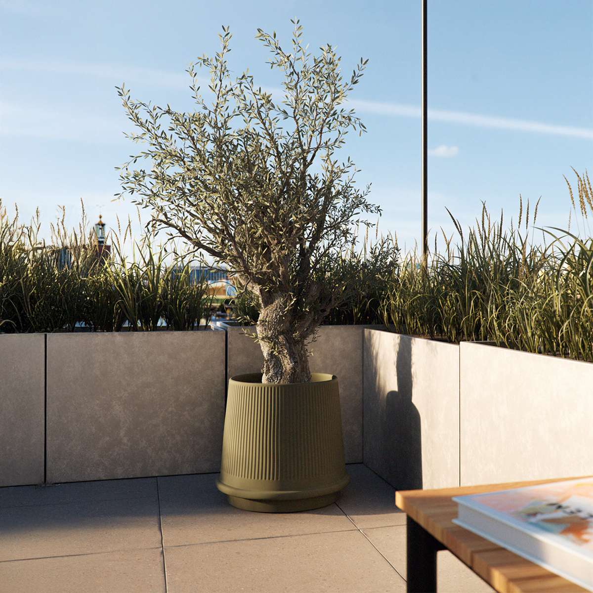 Olive green ceramic Gaia 38 outdoor planter with fluted surface and drainage hole