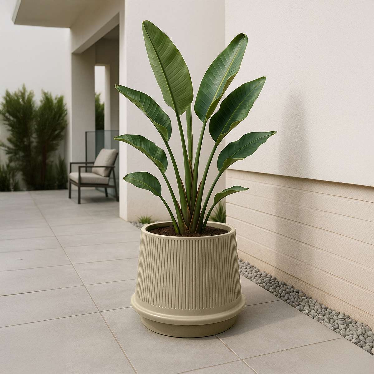 Sand-colored Gaia 38 ceramic outdoor planter with fluted surface and drainage hole