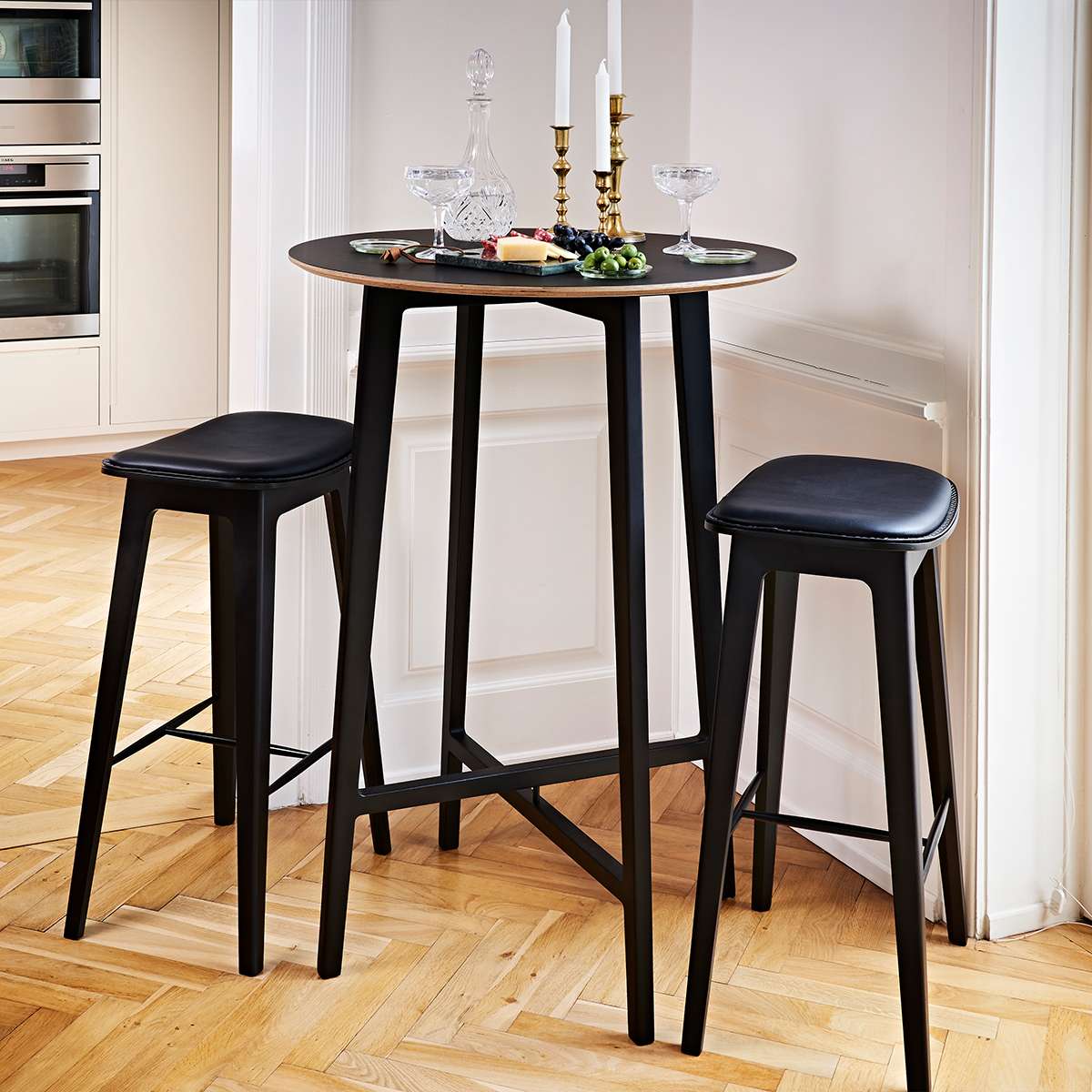 Nordic Bar Stool in black stained oak with Terra Black leather and matching stitching, high model.