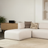 Fjord Sofa pouf in a soft, rounded shape with neutral upholstery in a cozy indoor setting