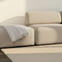 Cosmo Beige Fjord Sofa pouf with soft rounded edges and textured upholstery in a bright setting
