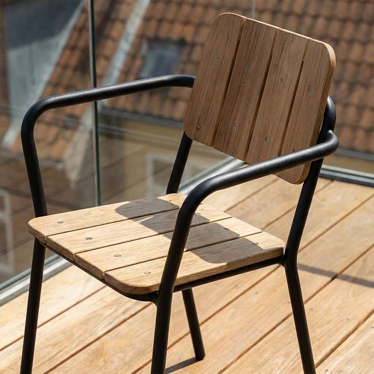 Kirra Patio Chair with powder-coated aluminum frame and teak wood seat and backrest, shown in outdoor setting.