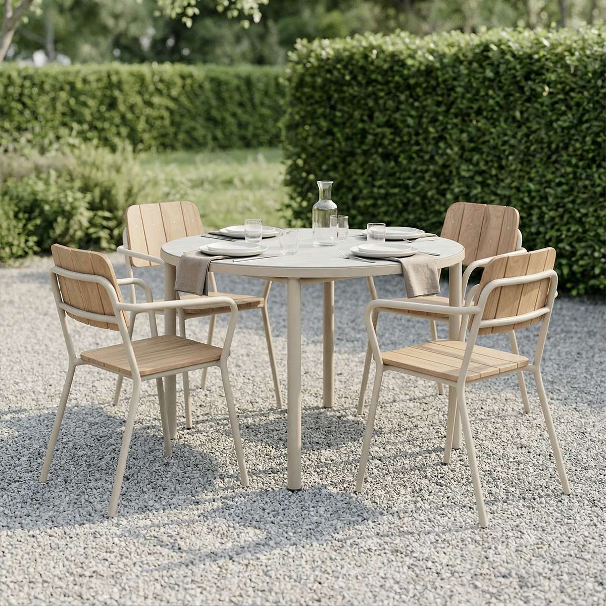 Kirra Patio Chair in taupe with powder-coated aluminum and teak wood, shown outdoors on a terrace