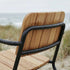 Noir Kirra Patio Lounge Chair with powder-coated aluminum frame and teak wood seat in relaxed outdoor setting