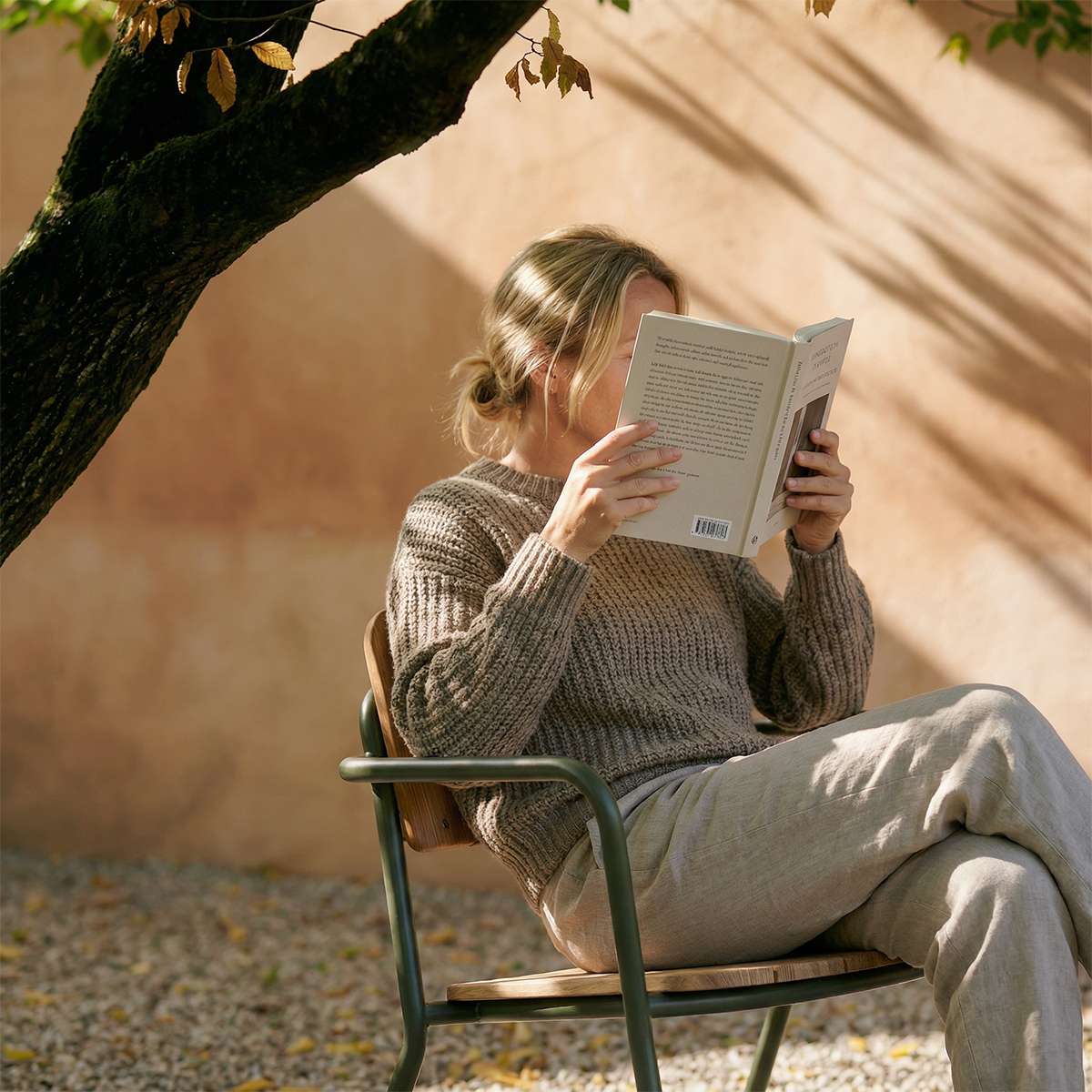 Olive Kirra Patio Lounge Chair with powder-coated aluminum frame and teak wood armrests outdoors