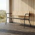 Noir Kirra Patio Bench with powder-coated aluminum frame and teak wood seat in outdoor setting