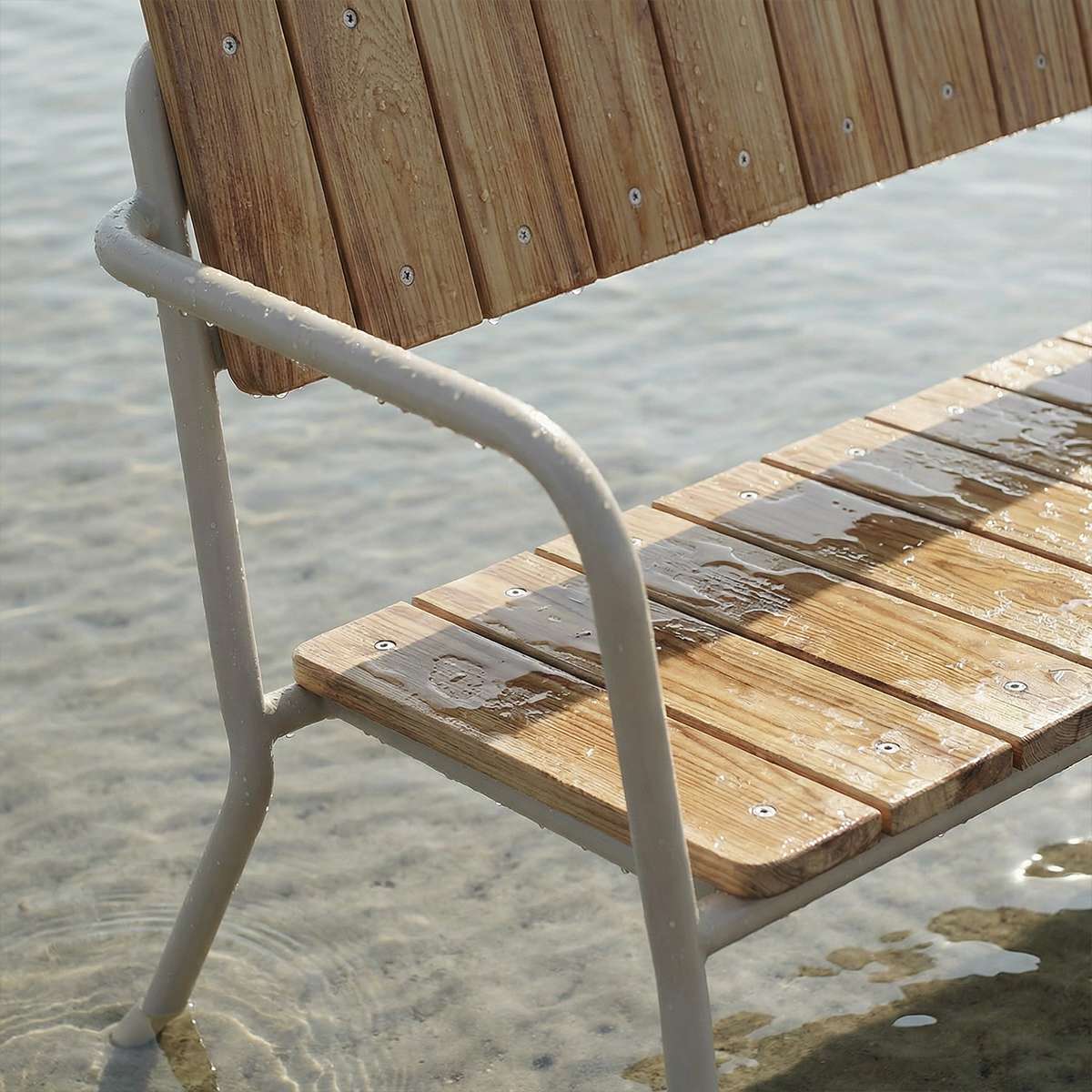 Kirra Patio Bench in taupe with powder-coated aluminum frame and teak wood seat, outdoor setting.