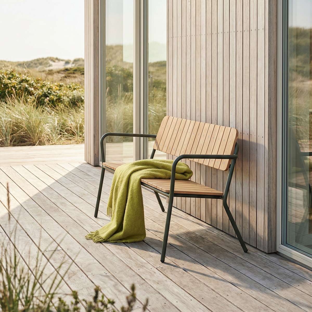 Olive Kirra Patio Bench with powder-coated aluminum frame and teak wood seat on outdoor patio