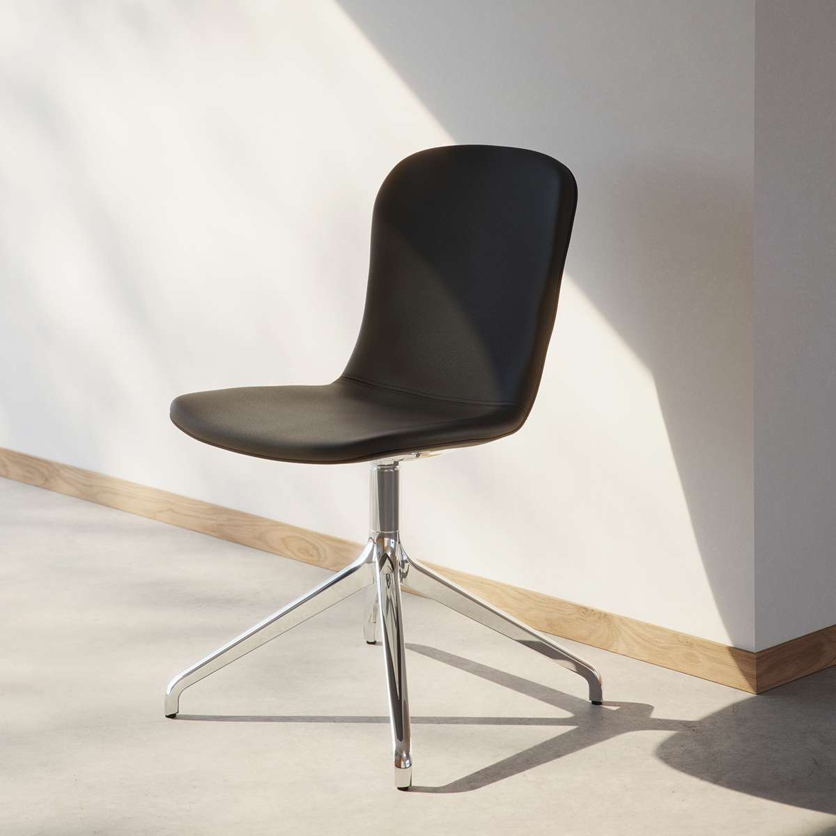 Chair no. One S1 dining chair in Terra Black leather with polished swivel base and recycled plastic shell.
