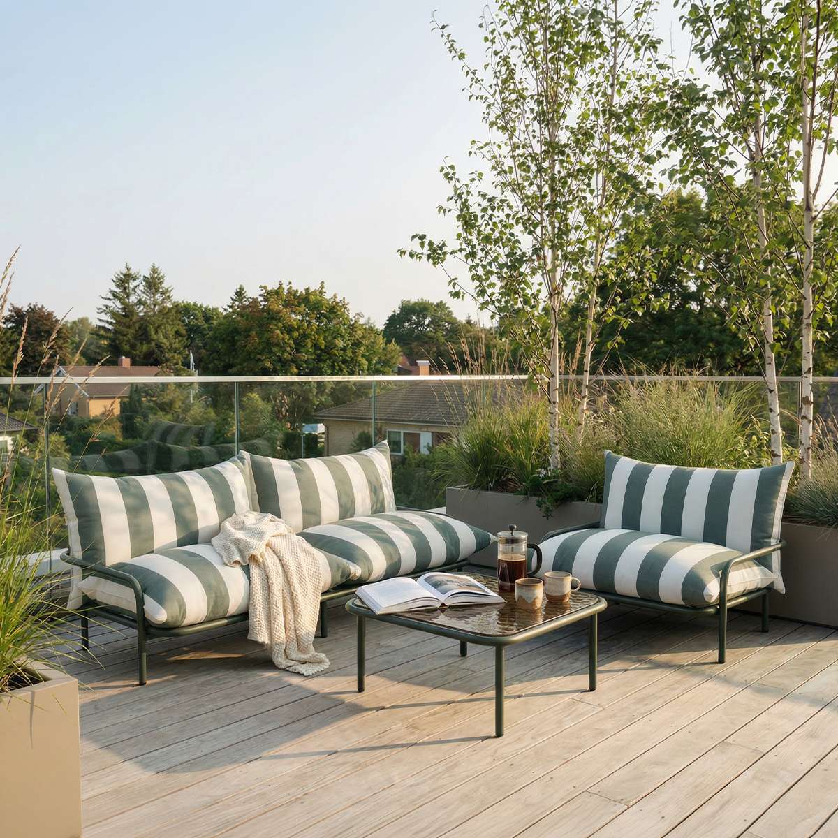 Square olive Mollis Coffee Table with powder-coated aluminum frame and smoked tempered glass top outdoors.