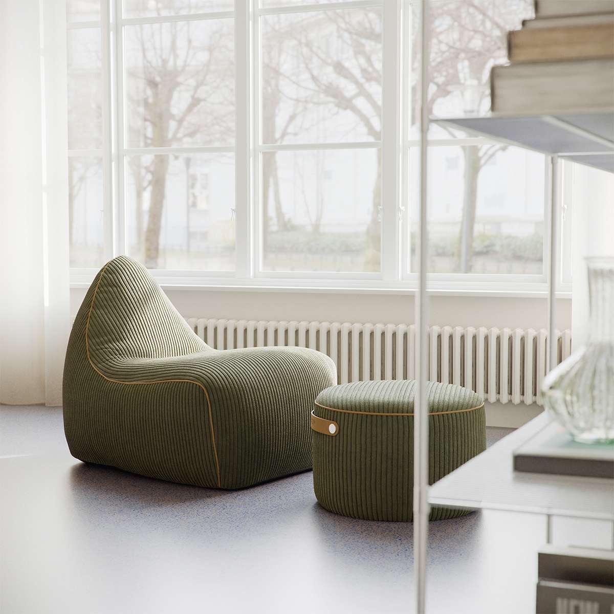 Corduroy rose SACKit Pouf Indoor with soft texture and compact round shape on a light floor.