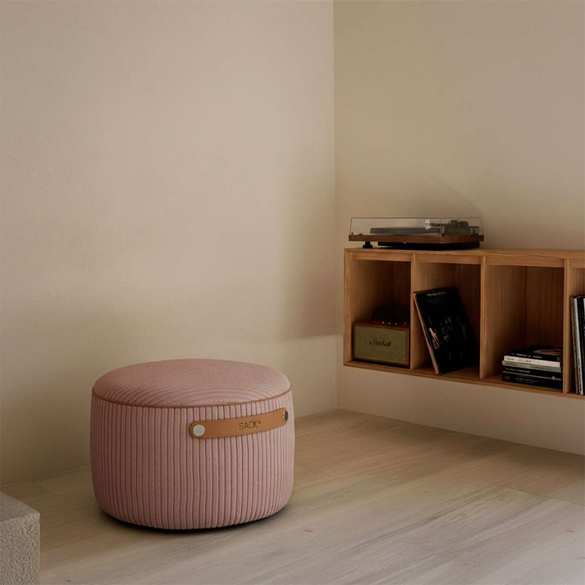 Round SACKit Pouf Indoor in rose corduroy fabric with a side handle and non-slip bottom dots