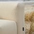 Soft Sofa Outdoor seat in boucle beige fabric placed in an outdoor setting