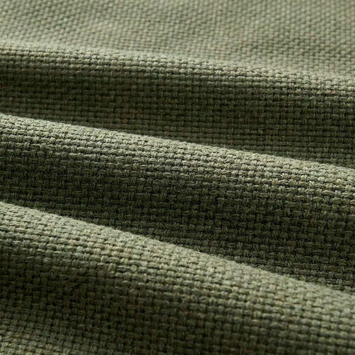 Close up of olive green woven upholstery on a Cobana outdoor lounge sofa with a tactile texture and clean Scandinavian design